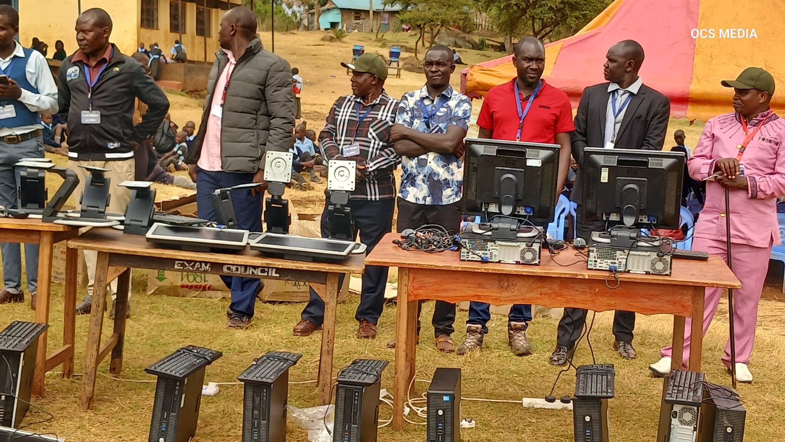 Alumni presenting donated computers to Kapchebon FYM